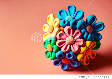 Small plasticine flower with rounded petals on delicate pink background Small plasticine flower with rounded petals on delicate pink background 97722441
