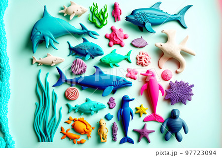 Plasticine sculptures of fish and other marine animals laid out on table Plasticine sculptures of fish and other marine animals laid out on table 97723094