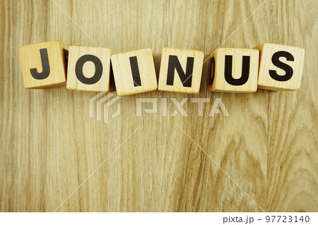 join us alphabet top view on wooden background 97723140