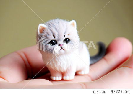 Cute plasticine kittens are molded by children and sit in palm of your hand 97723356