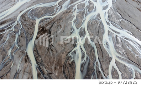Glacial rivers from above. Aerial photograph of the river streams from Icelandic glaciers. Beautiful art of the Mother nature created in Iceland. Wallpaper background  97723825
