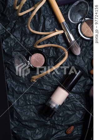 set of cosmetics and nature chocolate on black background 97724156