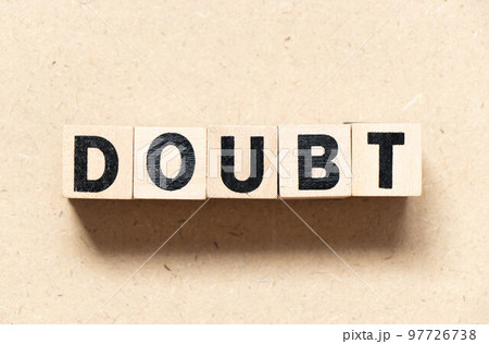 Alphabet letter block in word doubt on wood background 97726738