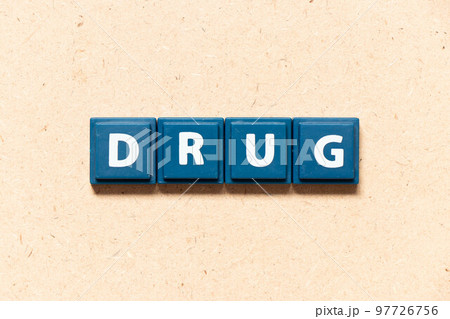 Tile letter in english word drug on wood background 97726756