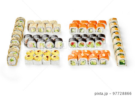 Set for family dinner with various Japanese sushi rolls 97728866