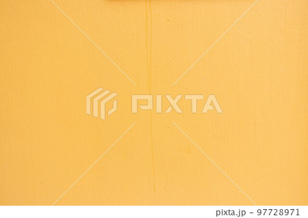 Grunge cracked yellow color concrete wall textured background as loft style Grunge cracked yellow color concrete wall textured background as loft style 97728971