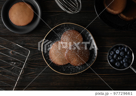 Concept of sweet food, chocolate pancakes, top view Concept of sweet food, chocolate pancakes, top view 97729661