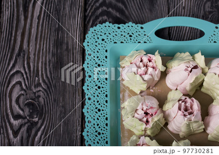 Zephyr tulips. Natural homemade marshmallow. Arranged on a tray. Close-up. Zephyr tulips. Natural homemade marshmallow. Arranged on a tray. Close-up. 97730281