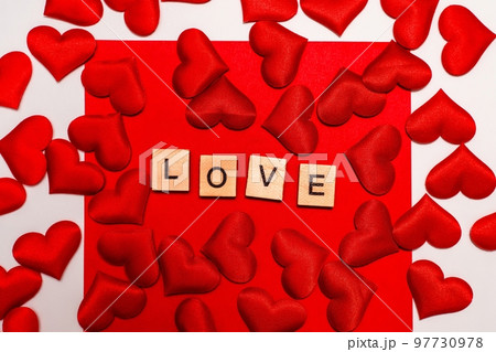 Top view of the inscription with the word love on a red background. Love concept, valentine's day. Top view of the inscription with the word love on a red background. Love concept, valentine's day. 97730978