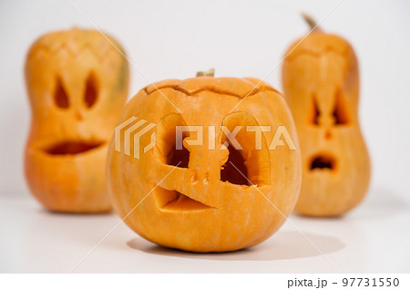 Three jack-o-lantern on a white background. Halloween decoration. Three jack-o-lantern on a white background. Halloween decoration. 97731550