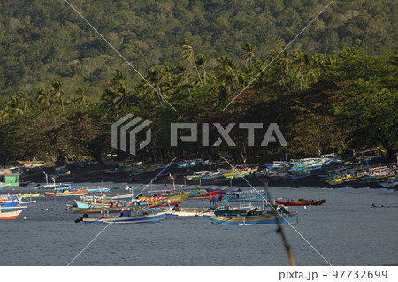Colorful fishing boats moored, Batu Putih Beach, Indonesia Colorful fishing boats moored, Batu Putih Beach, Indonesia 97732699
