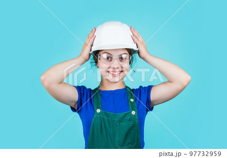 Visiting Construction Site. childhood and education concept. baby building. cute kid putting on construction helmet. childhood happiness concept. Little happy girl engineer Visiting Construction Site. childhood and education concept. baby building. cute kid putting on construction helmet. childhood happiness concept. Little happy girl engineer 97732959