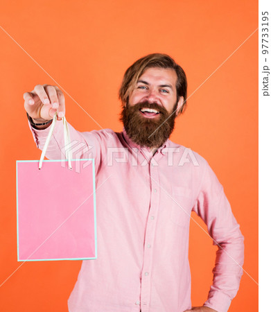crazy about shopping. bearded man gift holiday decoration. businessman holding gift pack. gift to colleague at work. surprised man unpacking. the package delivery. human emotion and facial expression 97733195
