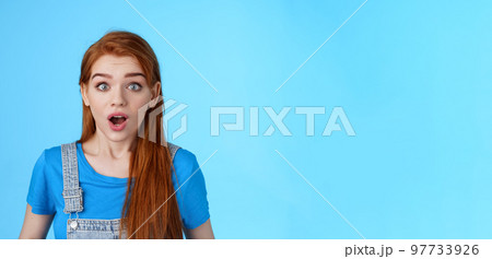 Shocked redhead girl react omg shook, drop jaw speechless, stare impressed gasping amazed, hear surprising news, stand blue background stunned, find out truth, found good opportunity Shocked redhead girl react omg shook, drop jaw speechless, stare impressed gasping amazed, hear surprising news, stand blue background stunned, find out truth, found good opportunity 97733926