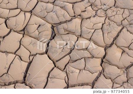 Cracked bottom of a dry reservoir, beautiful fractured texture 97734055