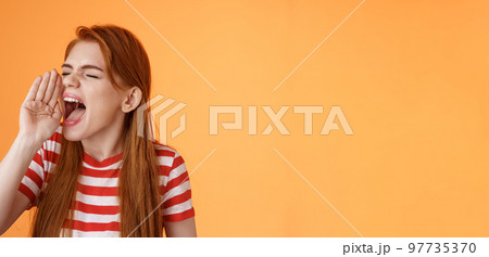 Hey where are you. Cute carefree redhead funny girl hold hand near opened mouth turn left close eyes, yelling out loud, searching someone, calling friend come upstairs, look for person distance Hey where are you. Cute carefree redhead funny girl hold hand near opened mouth turn left close eyes, yelling out loud, searching someone, calling friend come upstairs, look for person distance 97735370