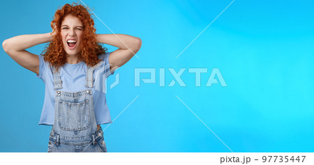 Wild daring rebellious cool stylish redhead curly girl having fun playful exciting mood touch hair yelling singing along awesome concert music enjoy positive summer vibes wear overalls Wild daring rebellious cool stylish redhead curly girl having fun playful exciting mood touch hair yelling singing along awesome concert music enjoy positive summer vibes wear overalls 97735447
