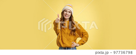 Lucky good-looking friendly supportive girlfriend congratulating you nice work good job show thumb-up gesture satisfied liking awesome product recommend promotion, smiling yellow background 97736798