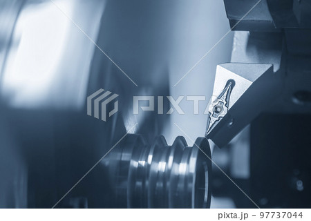 The CNC lathe machine V-groove cutting operation. The CNC lathe machine V-groove cutting operation. 97737044