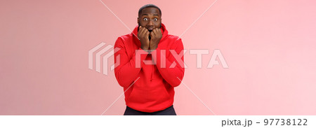 Excited overwhelmed young african american bearded man biting fingers widen eyes impressed dying anticiapting see famour singer live anticipating thrilling moment, standing pink background nervous Excited overwhelmed young african american bearded man biting fingers widen eyes impressed dying anticiapting see famour singer live anticipating thrilling moment, standing pink background nervous 97738122