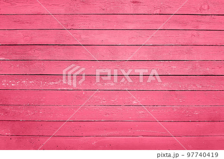 Trendy color of the year 2023. Wooden planks boards, gorizontal pattern, toned in viva magenta color as background or texture 97740419