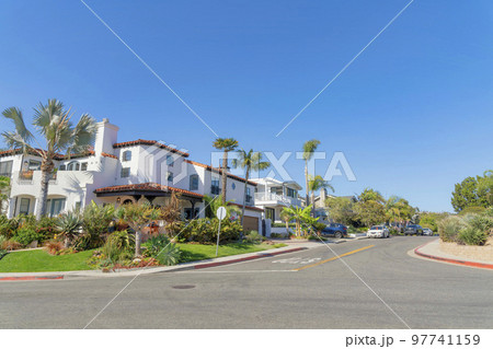 Intersection road in a residential area with mediterranean style houses at San Clemente, California 97741159