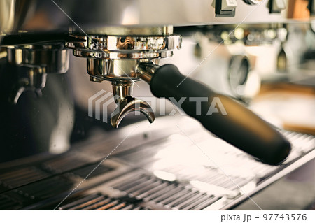 Close up of coffee machine pouring espresso in cafe, Close up of coffee machine pouring espresso in cafe, 97743576