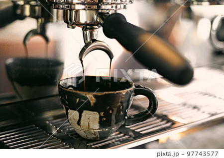 Close up of coffee machine pouring espresso in cafe, Close up of coffee machine pouring espresso in cafe, 97743577