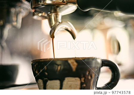 Close up of coffee machine pouring espresso in cafe, Close up of coffee machine pouring espresso in cafe, 97743578