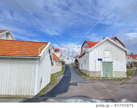 A view of red wooden houses on Vrango Archipelago island . A view of red wooden houses on Vrango Archipelago island . 97745975