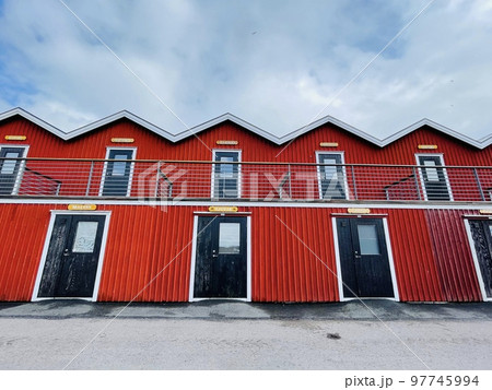 A view of red wooden houses on Donso Archipelago island . A view of red wooden houses on Donso Archipelago island . 97745994