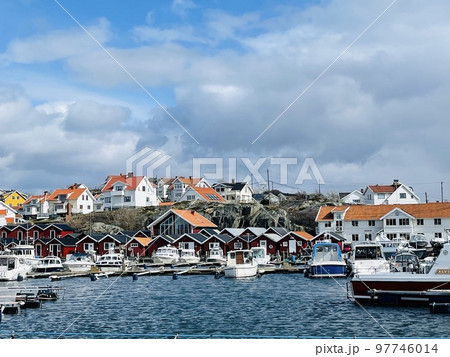 A view of red wooden houses on Donso Archipelago island . A view of red wooden houses on Donso Archipelago island . 97746014