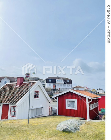 A view of red wooden houses on Vrango Archipelago island . 97746055