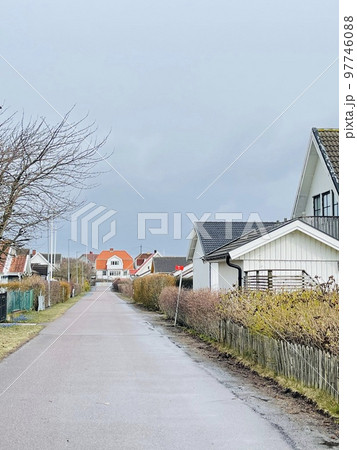 A view of red wooden houses on Vrango Archipelago island . 97746088