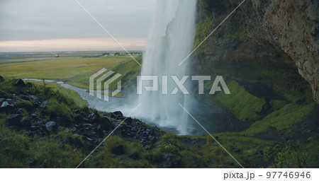 Close up of beautiful Seljalandfoss waterfall by sunset, Iceland Close up of beautiful Seljalandfoss waterfall by sunset, Iceland 97746946