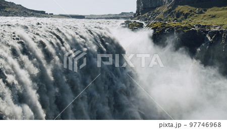Massive and epic waterfall Dettifoss Riging water volume falling down over the edge Iceland, Europe Massive and epic waterfall Dettifoss Riging water volume falling down over the edge Iceland, Europe 97746968