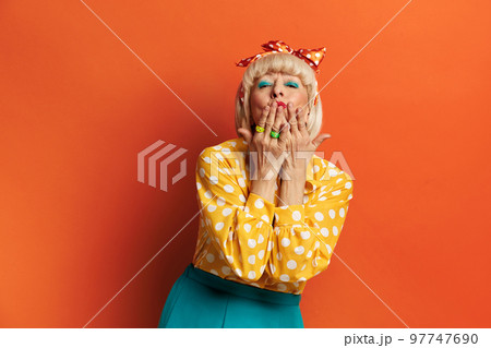 Senior Woman Sending Air Kiss. Beautiful Grandmother Blowing Kiss 97747690