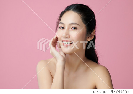 Beautiful young asian woman with clean fresh skin on pink background, Face care, Facial treatment, Cosmetology, beauty and spa, Asian women portrait. Beautiful young asian woman with clean fresh skin on pink background, Face care, Facial treatment, Cosmetology, beauty and spa, Asian women portrait. 97749155