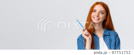 Close-up portrant attractive talented redhead girl got inspired want draw something, holding colored pencil, studying art at online courses, smiling, standing white background joyful 97751752