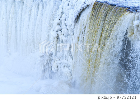 Frozen small mountain waterfall close up. Frozen Jagala Falls, Estonia Frozen small mountain waterfall close up. Frozen Jagala Falls, Estonia 97752121