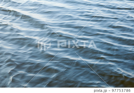 Water surface with ripples 97753786