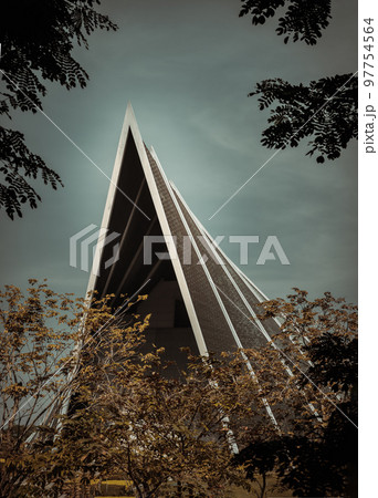 Architecture view of The Modern building with trees garden with blue sky background. Architecture view of The Modern building with trees garden with blue sky background. 97754564