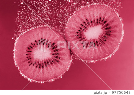 Kiwi in water with bubbles. Kiwi underwater Color 2023, viva magenta 97756642