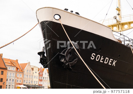 Old town in Gdansk. Famous Soldek ship. Soldek is first ship built in Poland after World War II. The riverside on Granary Island reflection in Moltawa River Cityscap. Ancient crane at dusk. Visit Old town in Gdansk. Famous Soldek ship. Soldek is first ship built in Poland after World War II. The riverside on Granary Island reflection in Moltawa River Cityscap. Ancient crane at dusk. Visit 97757118