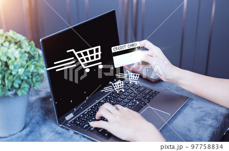 credit card filling in billing information in purchase of laptop computer in ecommerce store. Concept: online payment. Internet accessible money transactions 97758834