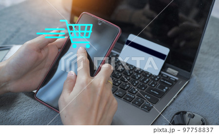 credit card filling in billing information in purchase of laptop computer in ecommerce store. Concept: online payment. Internet accessible money transactions 97758837