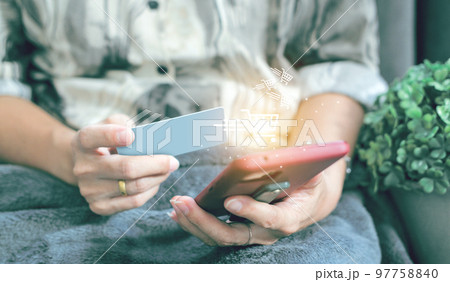 credit card filling in billing information in purchase of laptop computer in ecommerce store. Concept: online payment. Internet accessible money transactions 97758840