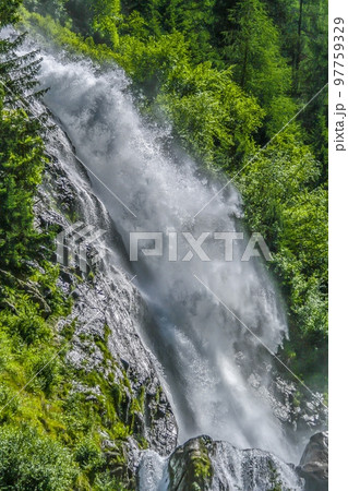 Image of high waterfall during the day Image of high waterfall during the day 97759329