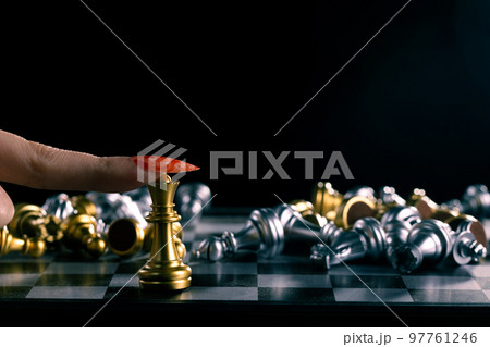 Business woman play queen Chess with close up finger nail. Leader use strategy game to challenge competitor with leadership to move Queen to victory with management team idea fight last stand 97761246