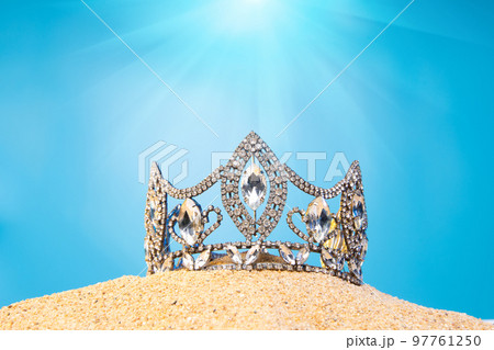 Desert Sand Ocean wind Diamond Crown put into Deep blue sky nature hot tropical island for Miss Beauty Pageant Contest Competition, bikini sash high heel shoes hang on outing trip camping background 97761250